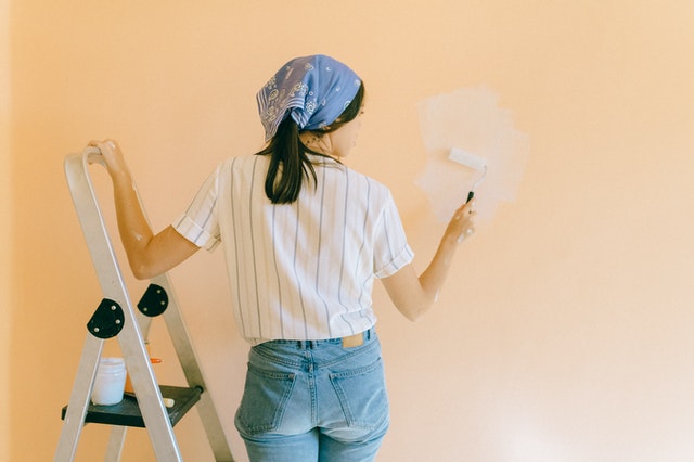 a%20person%20painting%20a%20wall%20in%20their%20home%20a%20light%20orange a%20person%20painting%20a%20wall%20in%20their%20home%20a%20light%20orange